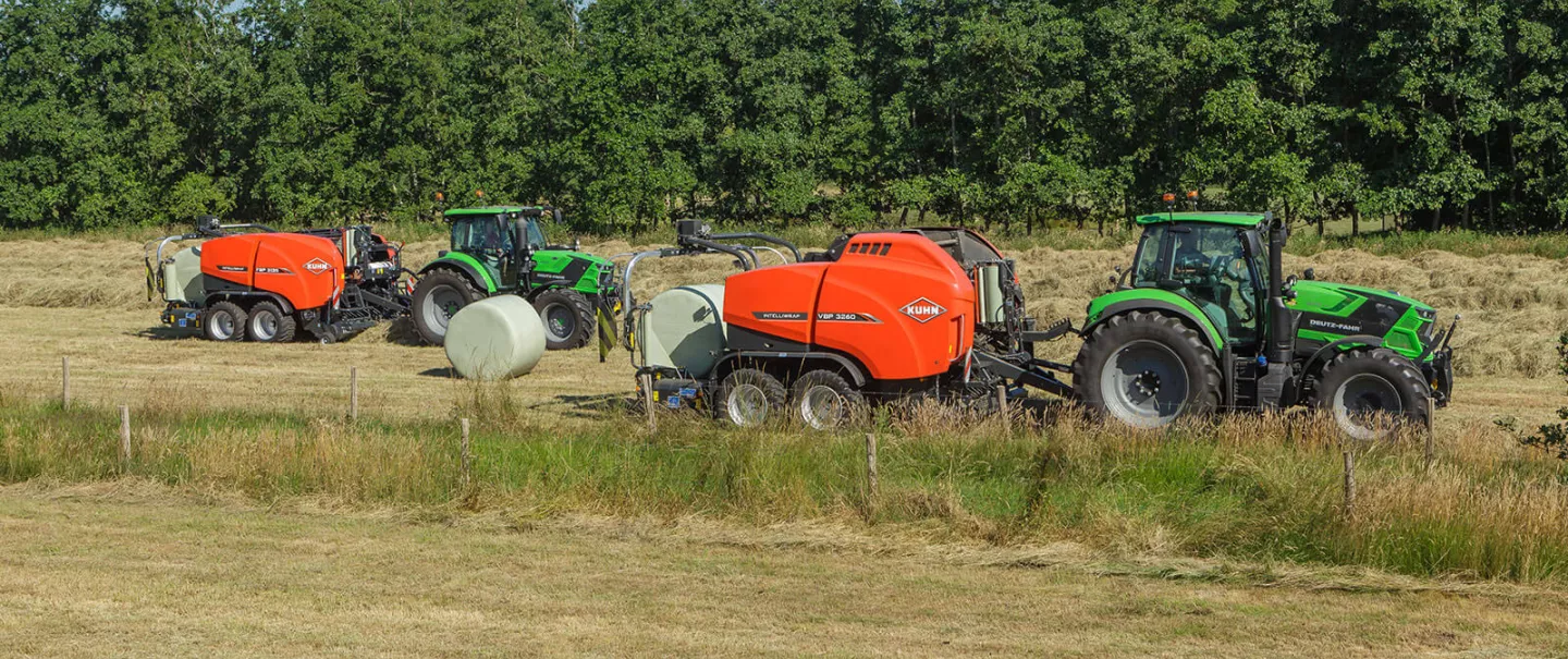 KUHN VBP3260 and FBP 3135 baler-wrapper combinations baling together in a field