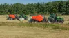 KUHN VBP3260 and FBP 3135 baler-wrapper combinations baling together in a field